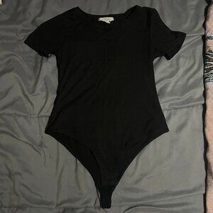 Black tight fitted bodysuit